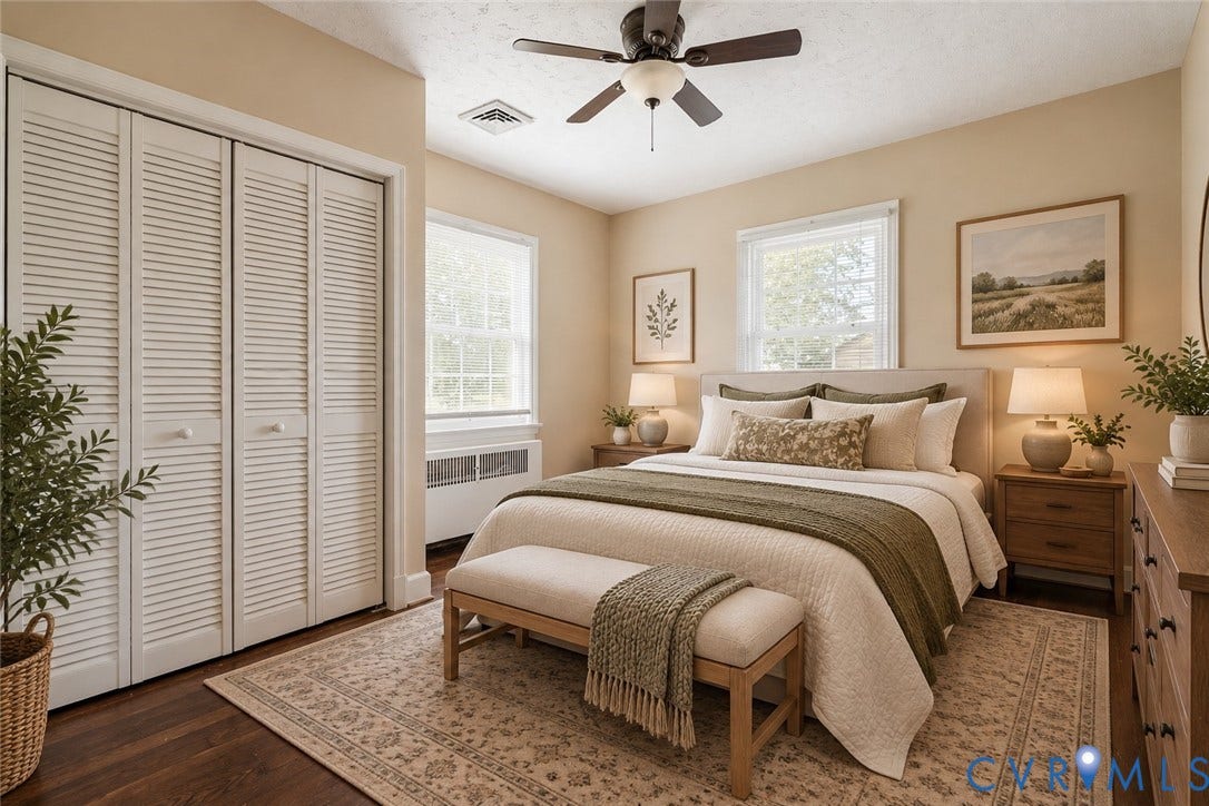 6227 Ellis Avenue, Henrico, VA 23228 Virtually staged. Primary bedroom featuring wood-finish flooring, warm neutral wall finishes, and abundant natural light from multiple windows