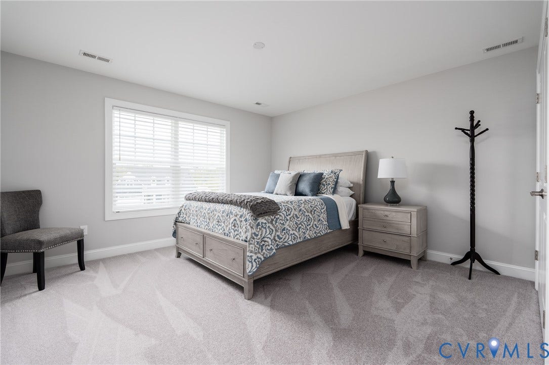 12303 Beech Hall Circle, Manakin Sabot, VA 23103 Wall-to-wall carpeting with a subtle pattern, large window with blinds, recessed ceiling lighting, and a white interior door