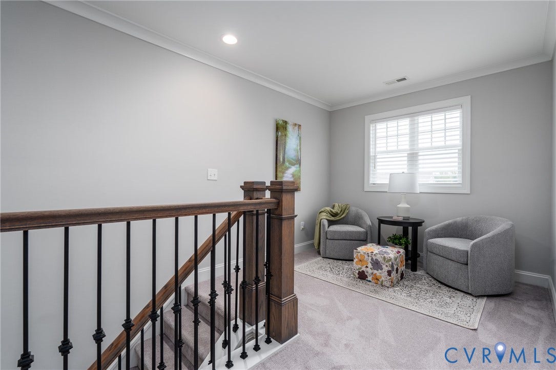 12303 Beech Hall Circle, Manakin Sabot, VA 23103 Staircase featuring dark wood handrails and wrought iron balusters