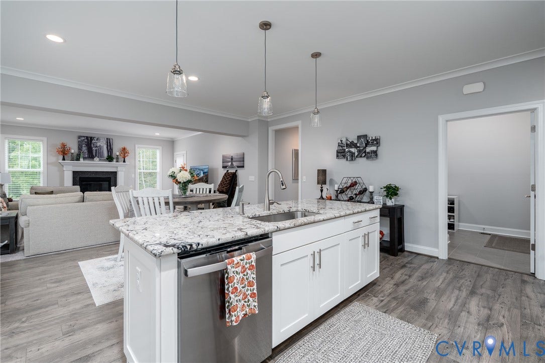 12303 Beech Hall Circle, Manakin Sabot, VA 23103 Kitchen island with a stainless steel sink, pull-down faucet, and granite countertop