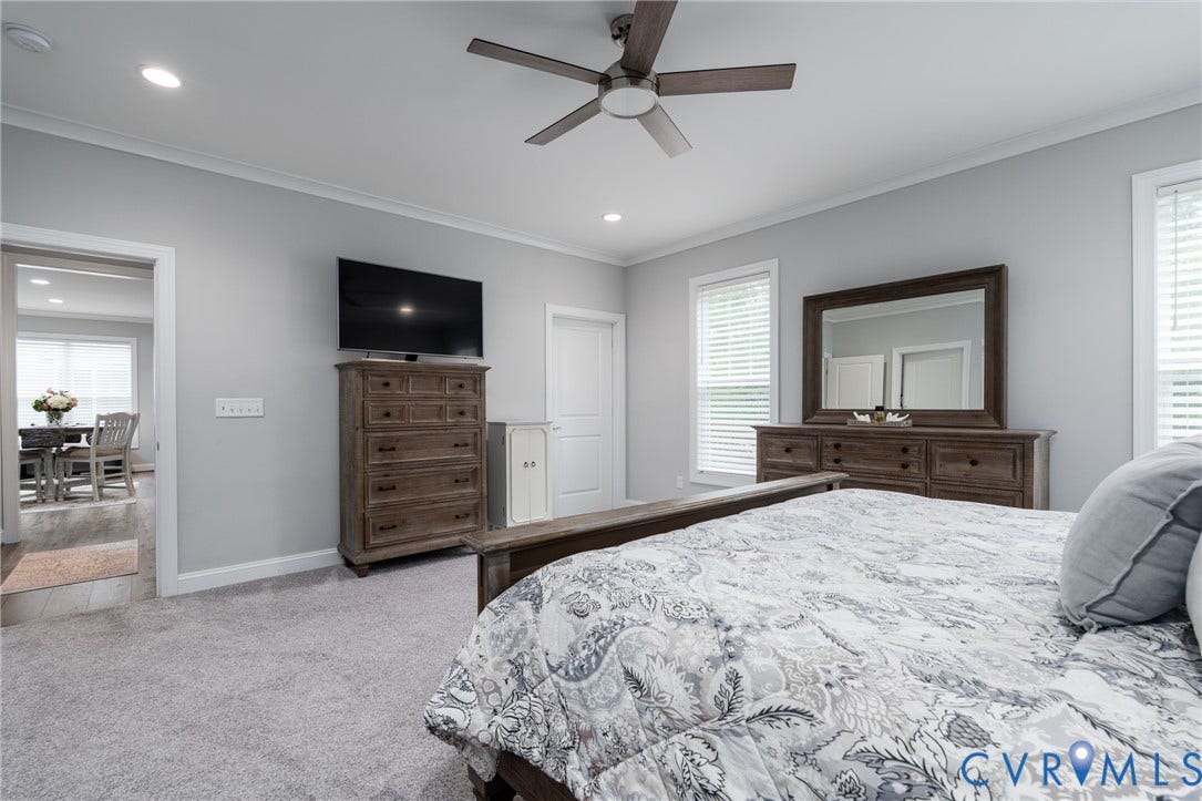 12303 Beech Hall Circle, Manakin Sabot, VA 23103 Recessed lighting, ceiling fan with light, crown molding, and two windows with blinds