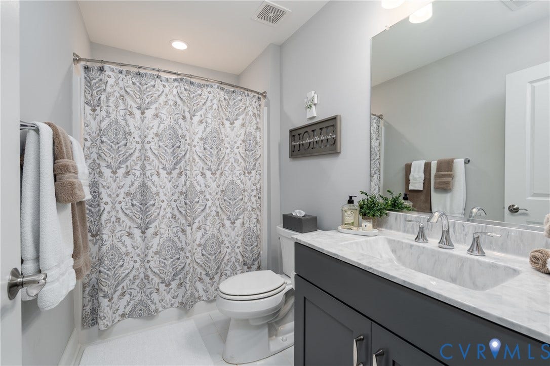 12303 Beech Hall Circle, Manakin Sabot, VA 23103 Vanity with integrated sink, polished chrome faucet, and gray cabinetry