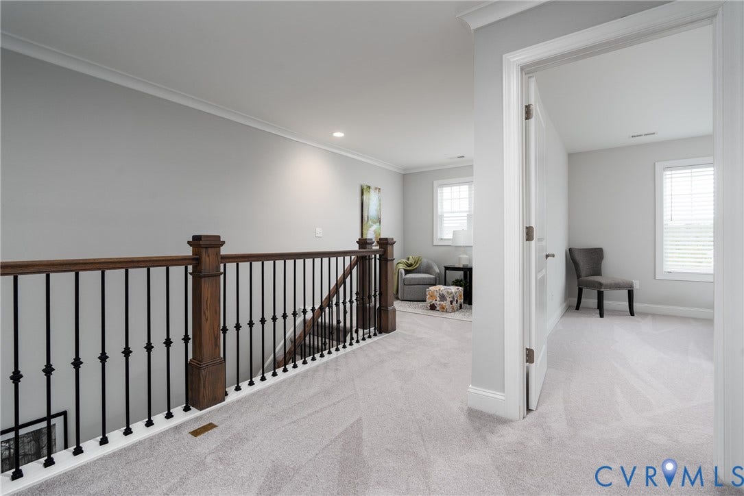 12303 Beech Hall Circle, Manakin Sabot, VA 23103 Carpeted landing with white crown molding, recessed lighting, and a wood and wrought iron staircase railing
