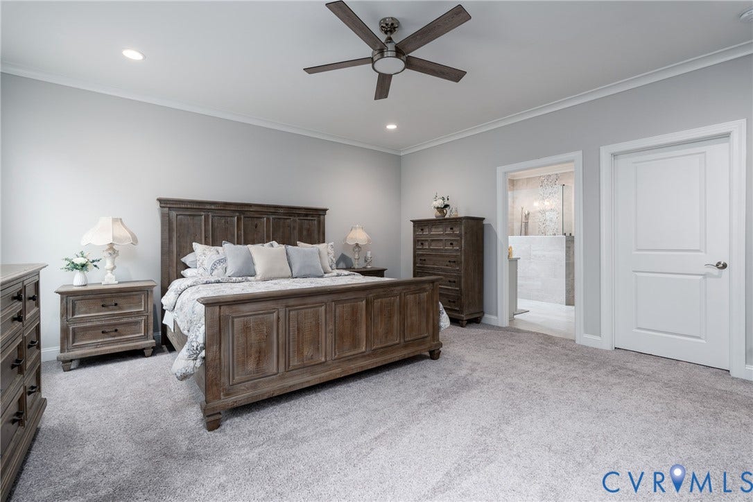 12303 Beech Hall Circle, Manakin Sabot, VA 23103 Plush carpet flooring, recessed lighting, ceiling fan, crown molding, and an adjoining space with tile flooring