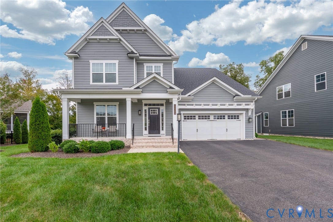 12303 Beech Hall Circle, Manakin Sabot, VA 23103 Gable roofline, covered front porch, two-car garage, paved driveway, and established landscaping