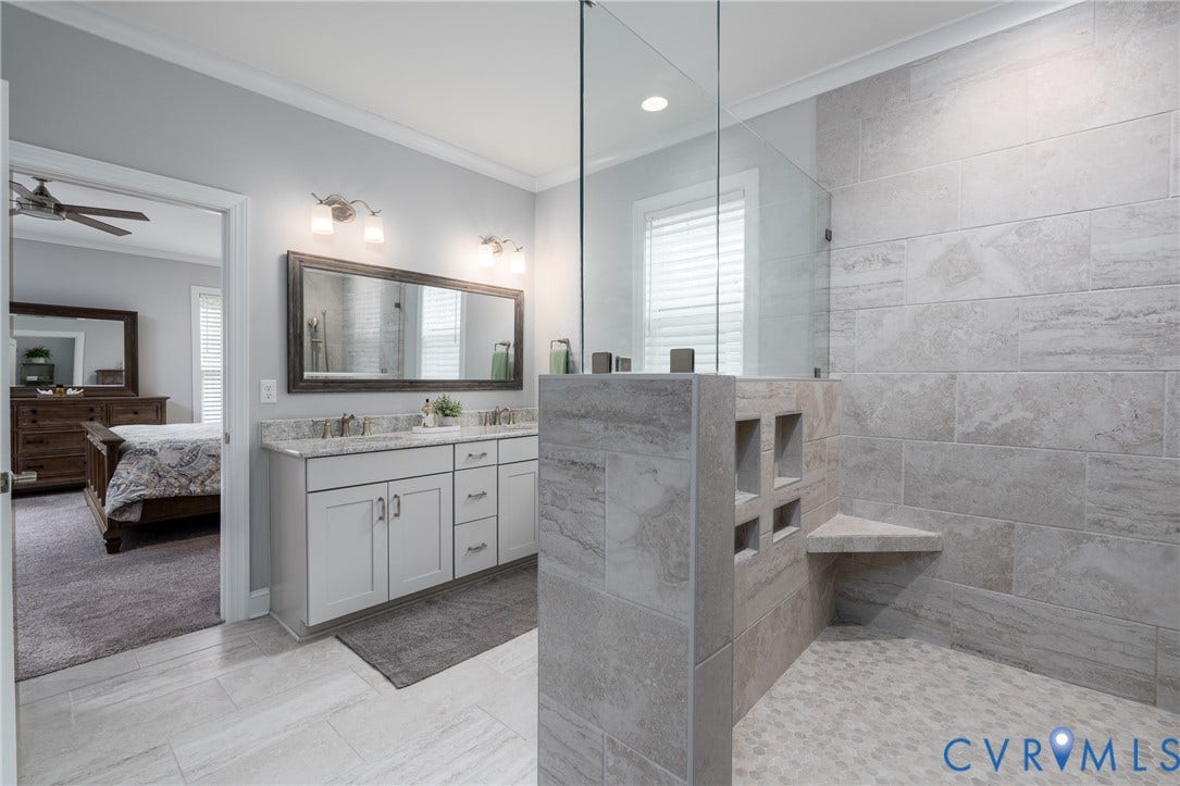 12303 Beech Hall Circle, Manakin Sabot, VA 23103 Walk-in shower with tiled walls and a built-in corner bench