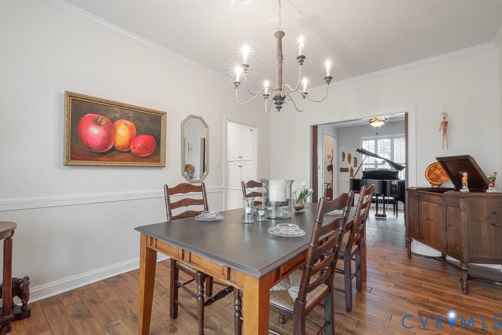 6301 Broad Sky Circle, Quiet, Mechanicsville, VA 23111 Wood-finish flooring throughout, crown molding, and a chandelier lighting fixture