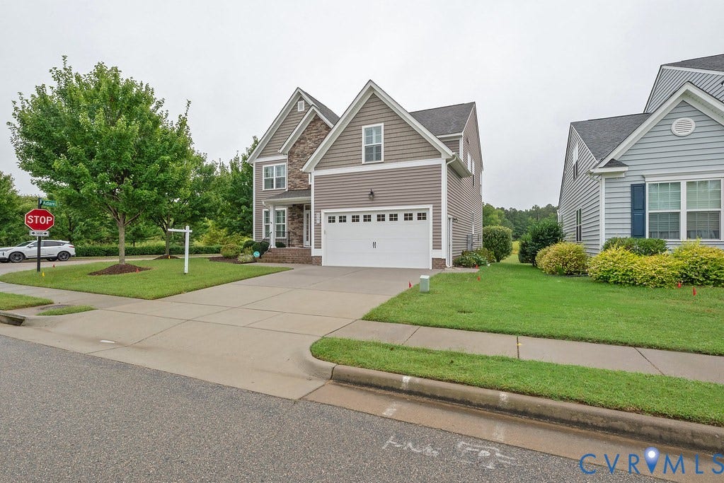6301 Broad Sky Circle, Quiet, Mechanicsville, VA 23111 Two-story residence featuring a mixed-material exterior, attached garage, and concrete driveway