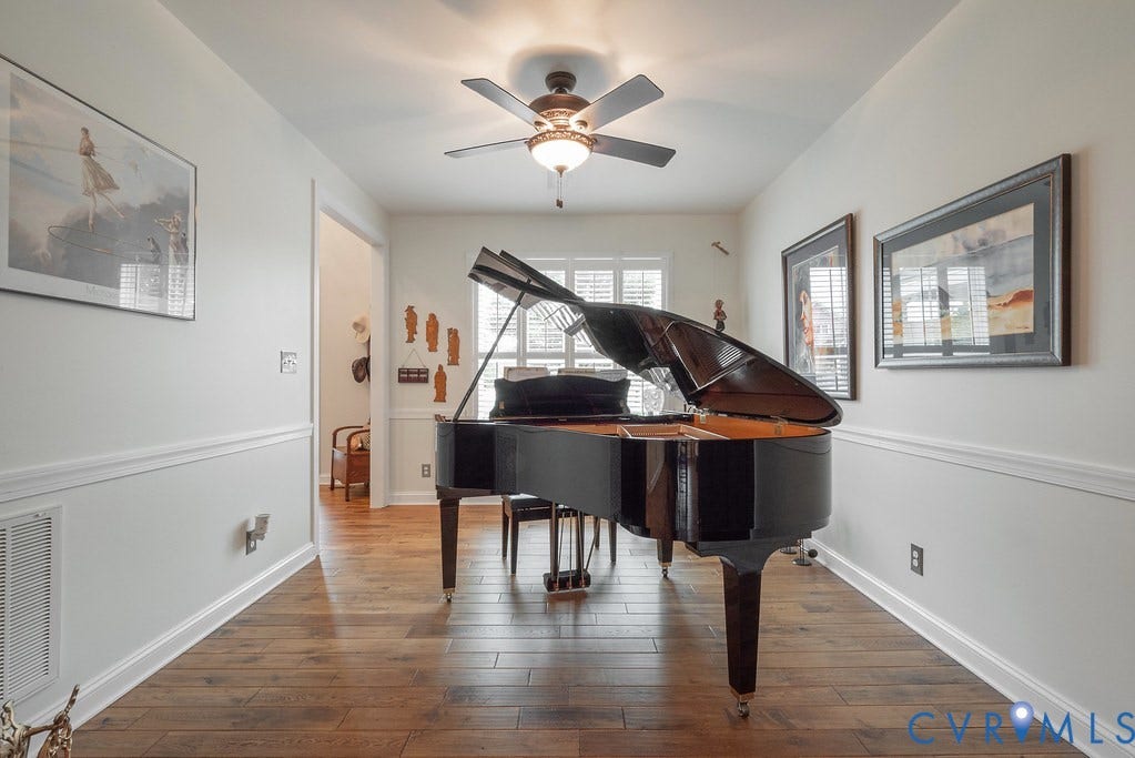 6301 Broad Sky Circle, Quiet, Mechanicsville, VA 23111 Recessed lighting, wood-finish flooring, ceiling fan with integrated lighting, window with plantation shutters, and wainscoting