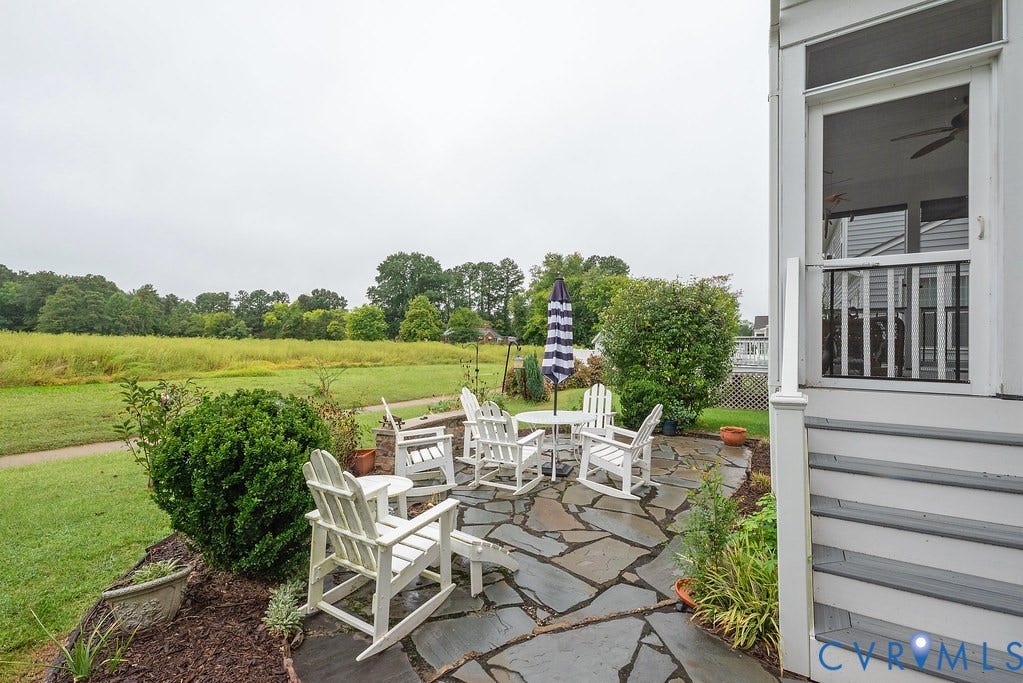6301 Broad Sky Circle, Quiet, Mechanicsville, VA 23111 Flagstone patio featuring mature landscaping and direct access to a screened porch