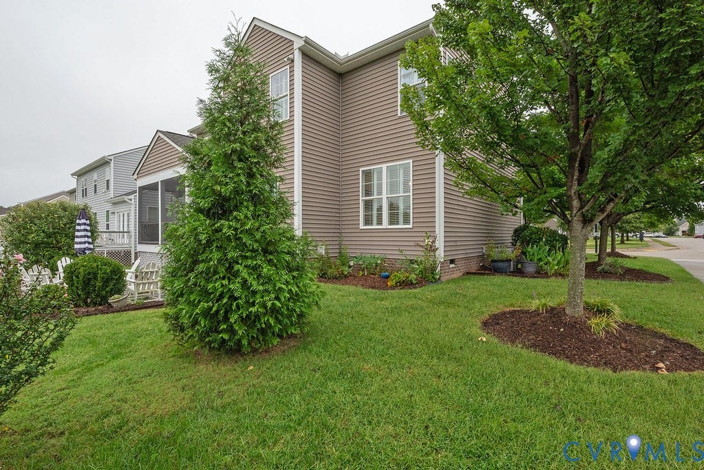6301 Broad Sky Circle, Quiet, Mechanicsville, VA 23111 Expansive lawn with mature trees, screened porch, wood deck, and horizontal siding