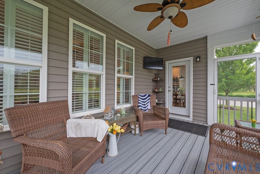 6301 Broad Sky Circle, Quiet, Mechanicsville, VA 23111 Covered porch with horizontal siding, white trim windows, a ceiling fan, and composite decking