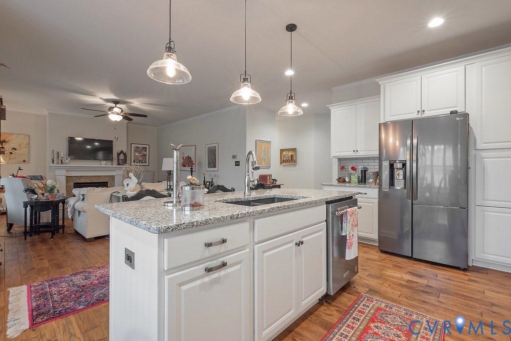 6301 Broad Sky Circle, Quiet, Mechanicsville, VA 23111 Kitchen island with granite countertop, integrated sink, and pendant lighting