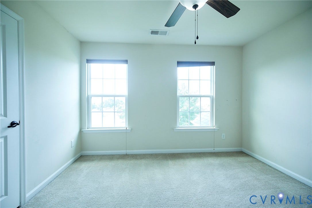 Neutral-toned carpeting paired with light walls