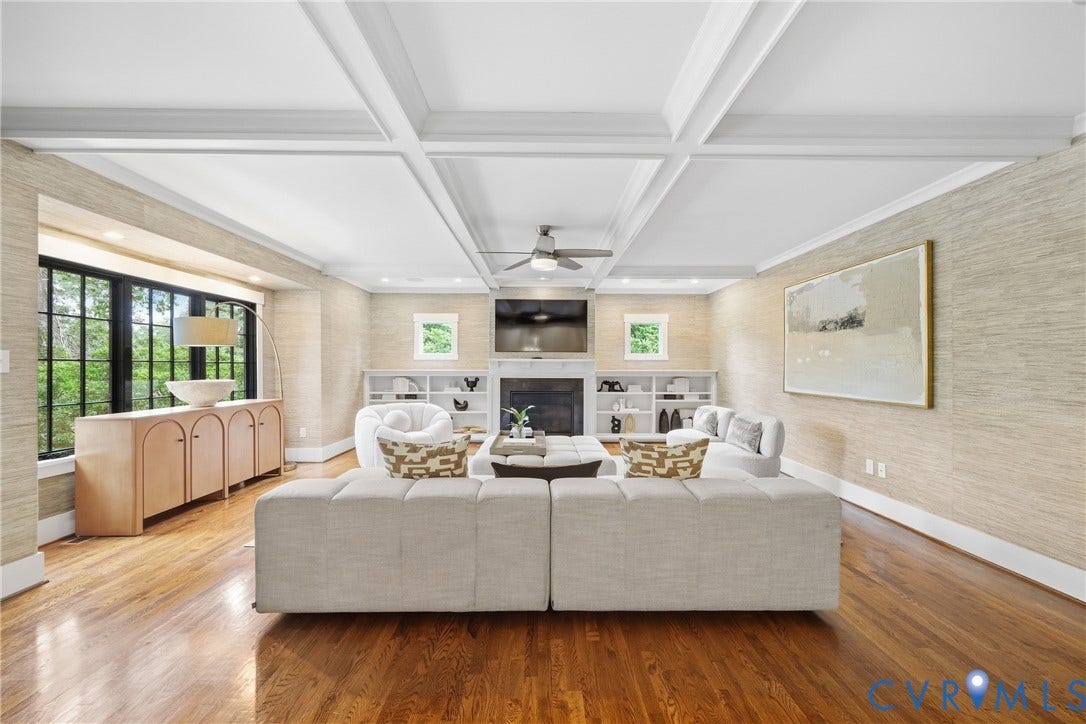 Recessed lighting, dark wood-finish flooring, and a coffered ceiling
