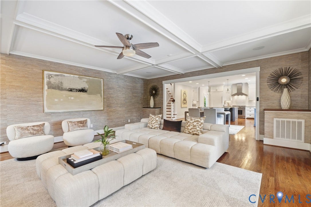 Coffered ceiling with a ceiling fan, hardwood flooring, and textured wall coverings