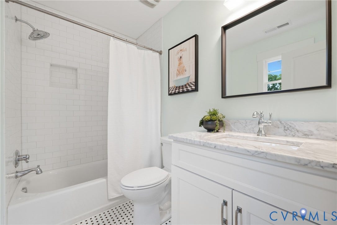 White subway tile shower surround with integrated niche