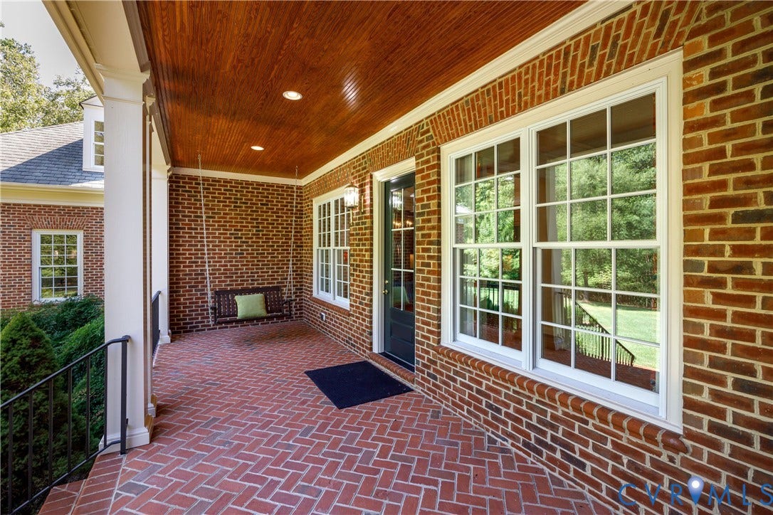628 Cedar Run Road, Hermitage Country Club Area, Manakin Sabot, VA 23103 The rear veranda features a herringbone pattern brick porch with a wood-paneled ceiling and recessed lights