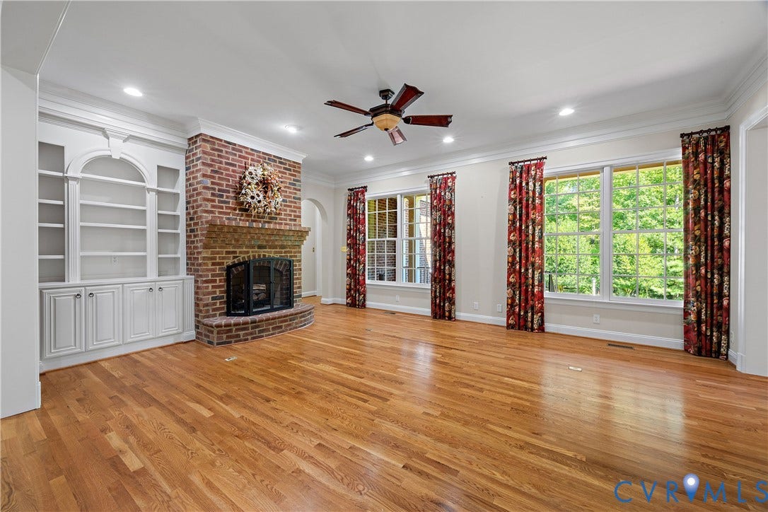 628 Cedar Run Road, Hermitage Country Club Area, Manakin Sabot, VA 23103 Two double windows overlooking the rear veranda and a brick, wood-burning fireplace.
