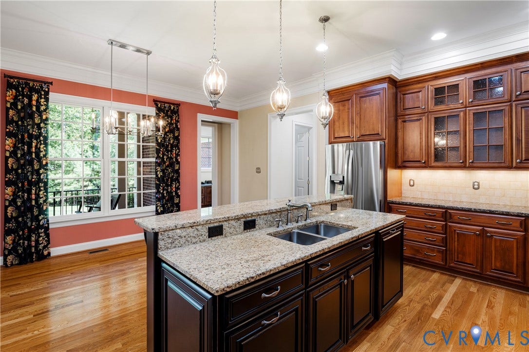 628 Cedar Run Road, Hermitage Country Club Area, Manakin Sabot, VA 23103 Kitchen features a breakfast area overlooking the rear veranda and center island with pendant lighting.