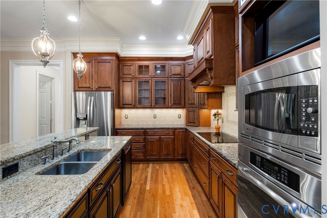 628 Cedar Run Road, Hermitage Country Club Area, Manakin Sabot, VA 23103 Gourmet kitchen features wood cabinetry, granite countertops, stainless steel appliances, a dual basin stainless sink, and recessed lighting