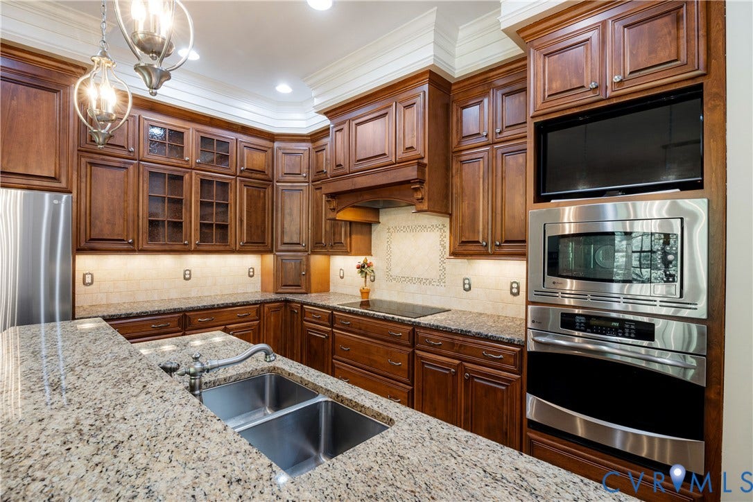 628 Cedar Run Road, Hermitage Country Club Area, Manakin Sabot, VA 23103 Granite countertops, extensive wood cabinetry, stainless steel appliances, double basin sink, and recessed lighting
