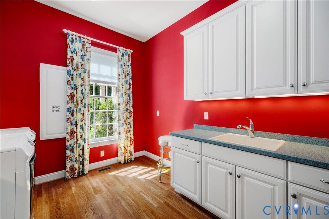 628 Cedar Run Road, Hermitage Country Club Area, Manakin Sabot, VA 23103 Hardwood floors continue into the spacious laundry room with built-in cabinetry and utility sink.
