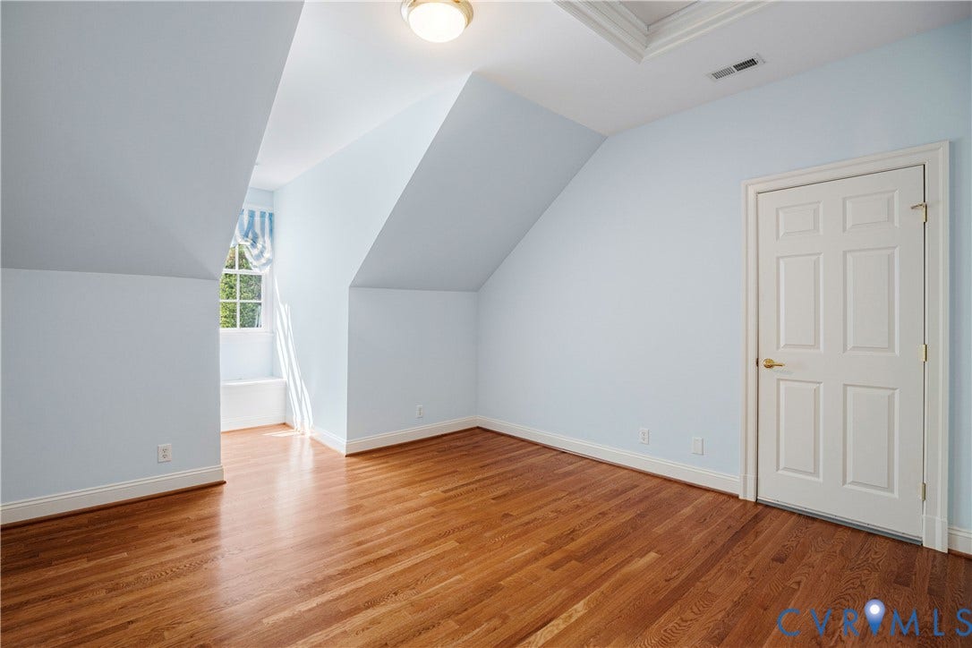 628 Cedar Run Road, Hermitage Country Club Area, Manakin Sabot, VA 23103 Bedroom Four features hardwood floors and access to the huge walk-in attic storage.