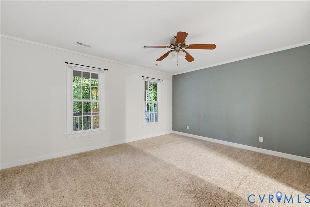 Recessed lighting, ceiling fan with light fixture, carpeted flooring, and two windows with white trim