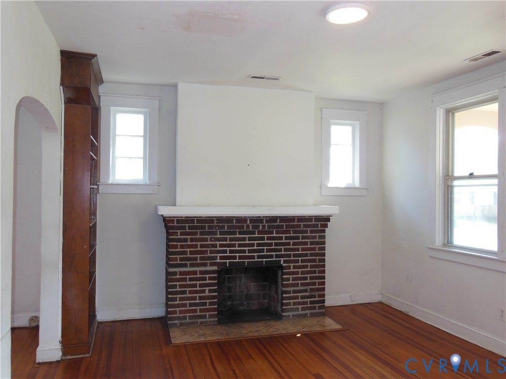 2120 Rhudy Street, Henrico, VA 23222 Brick fireplace with white mantel, wood-finish flooring, built-in bookcase