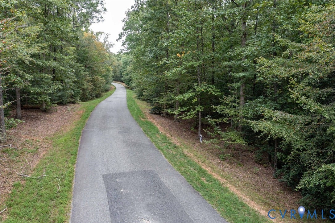 0 Taurman park Drive, Taurman Park, Powhatan, VA 23139 Paved pathway bordered by mature trees and natural ground cover