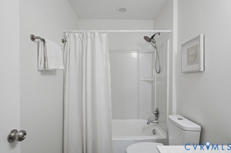 6012 Regal Crest Drive, Kings Grove, Chesterfield, VA 23832 White bathtub and shower combination with a curved shower curtain rod, a chrome showerhead, and recessed ceiling lighting