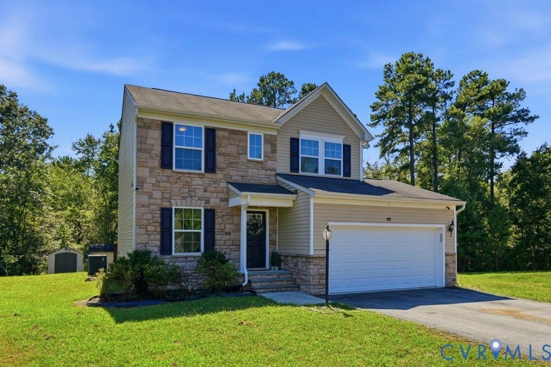 6012 Regal Crest Drive, Kings Grove, Chesterfield, VA 23832 Two-story residence featuring stone and siding exterior, attached two-car garage, and a shed structure