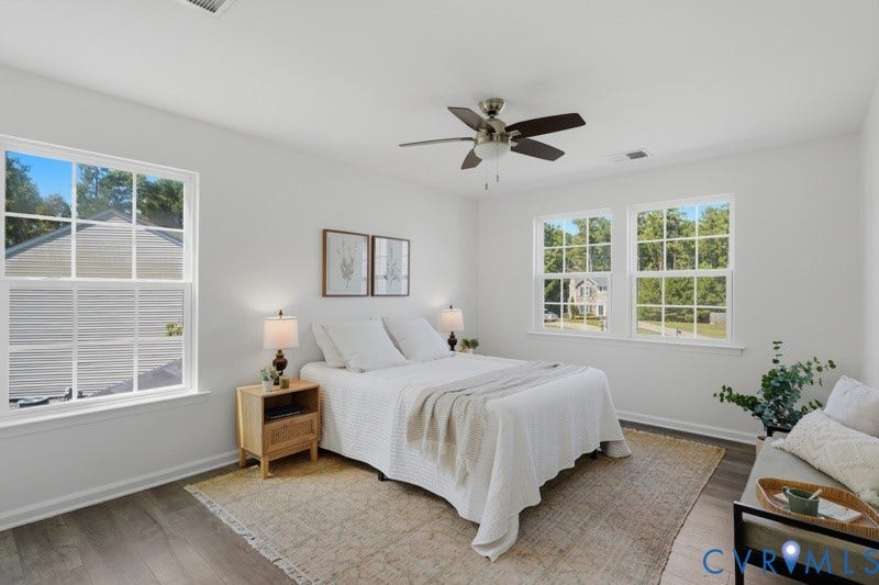 6012 Regal Crest Drive, Kings Grove, Chesterfield, VA 23832 Wood-finish flooring, multiple windows, ceiling fan, and crisp white walls