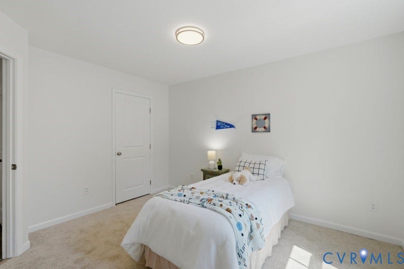 6012 Regal Crest Drive, Kings Grove, Chesterfield, VA 23832 Recessed panel door with polished hardware, neutral carpeting, and a flush mount ceiling fixture