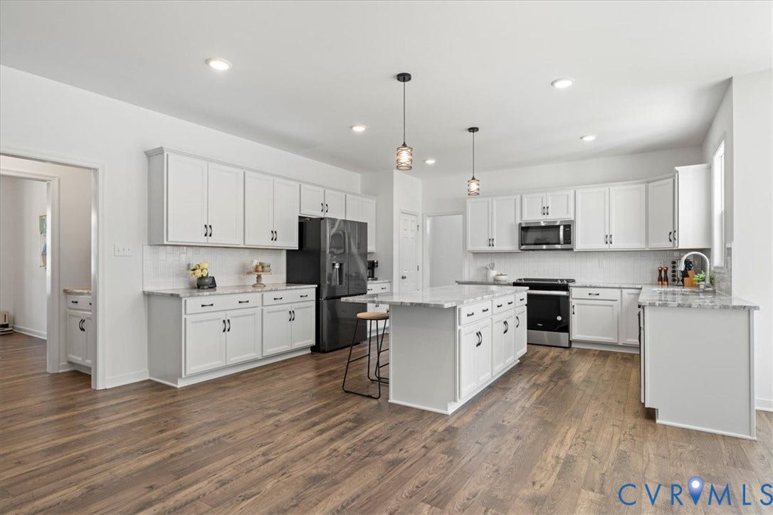 KItchen with view of butlers pantry connecting to dining room