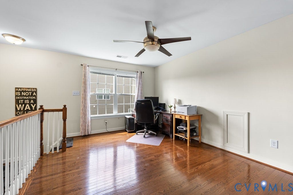 with hard wood floors and storage room