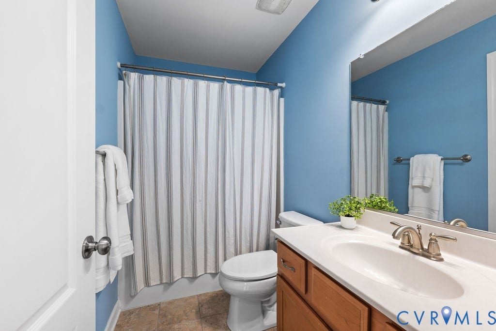 2nd floor full bath with ceramic tile floor and linen closet