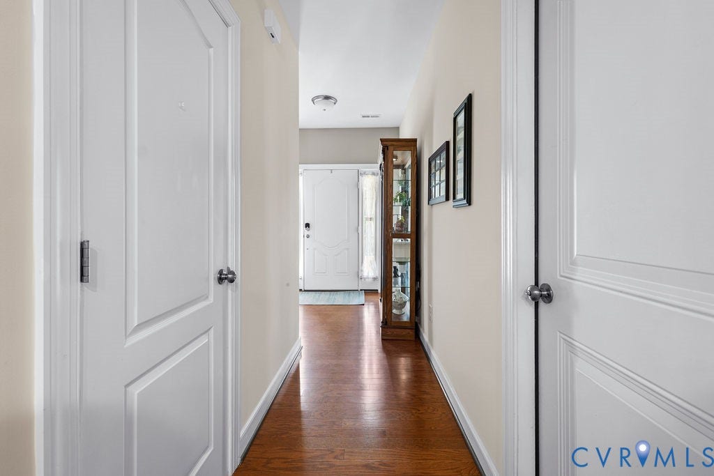 Foyer hall with half bath and garage entrance