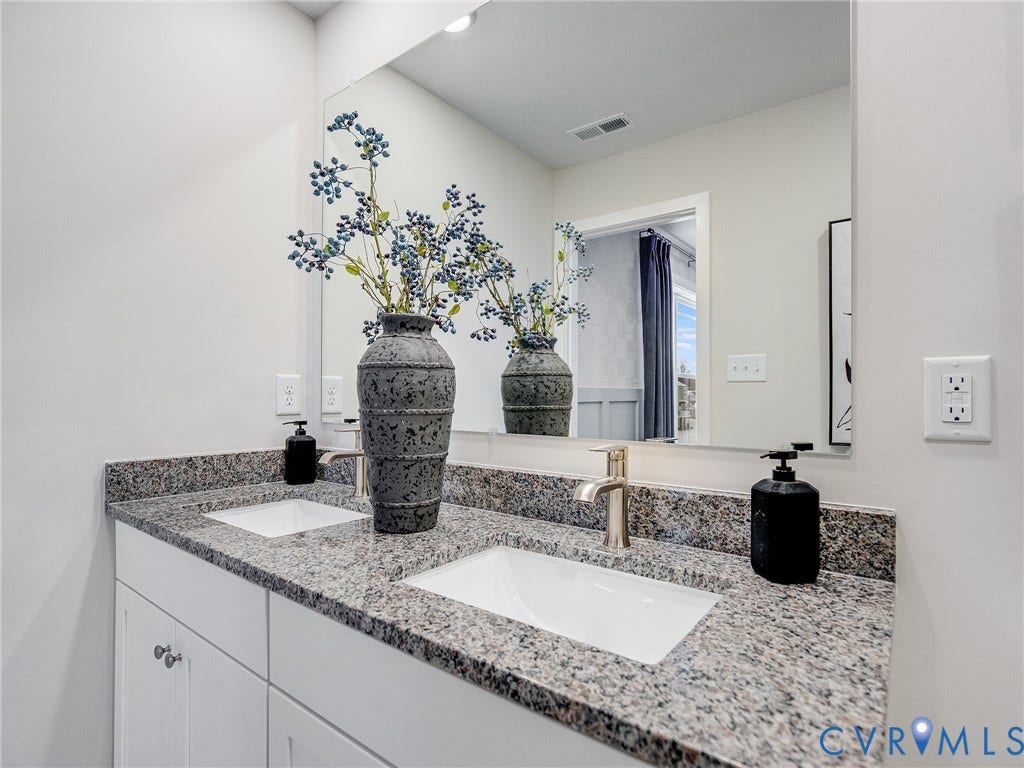3724 Larimar Lane, Everstone, Richmond, VA 23223 Dual undermount sinks with granite countertops, brushed nickel faucet, and white cabinetry