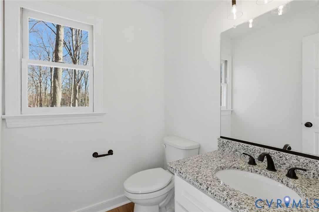 3264 Sherwood Ridge Way, Powhatan, VA 23139 1/2 bath 1st floor Vanity with a granite countertop, undermount sink, and dark bronze faucet