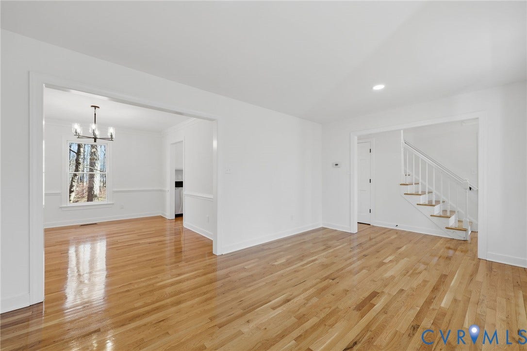 3264 Sherwood Ridge Way, Powhatan, VA 23139 Reflective wood-finish flooring, white painted walls, and open doorways