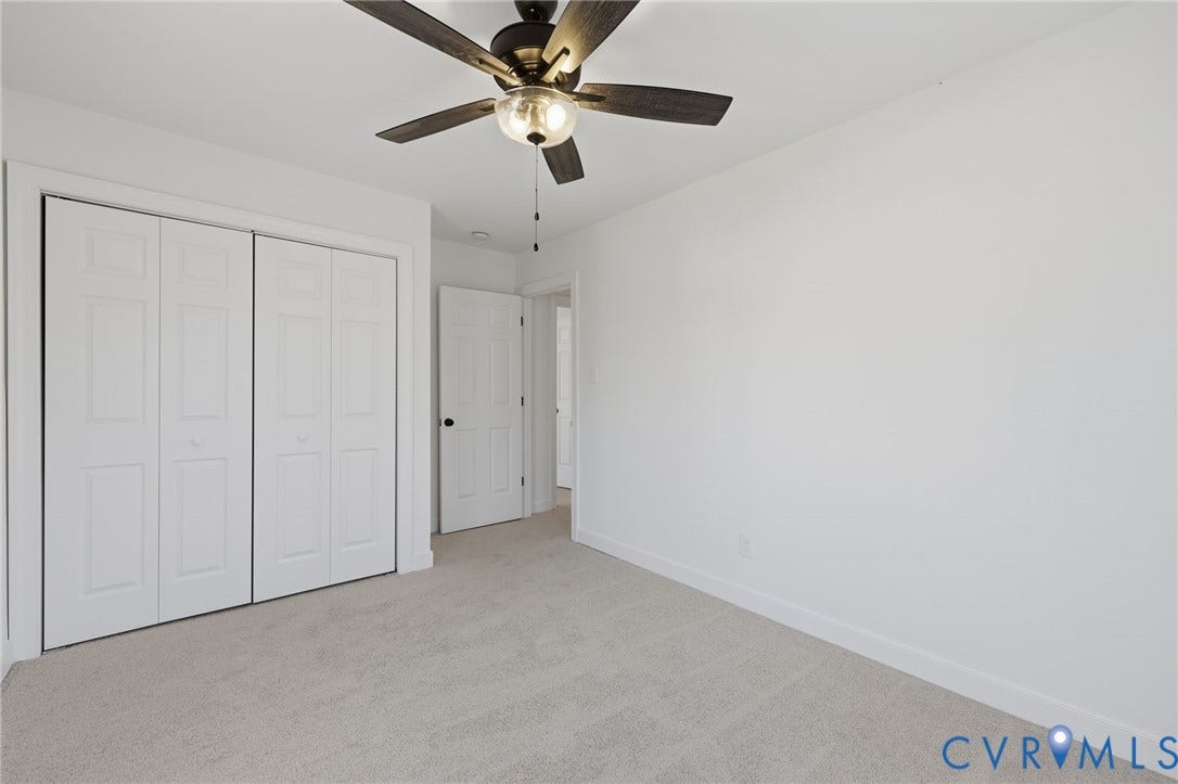 3264 Sherwood Ridge Way, Powhatan, VA 23139 Classic Colonial-style residence featuring a welcoming front porch with white columns and railings, red entry door, and brick chimney