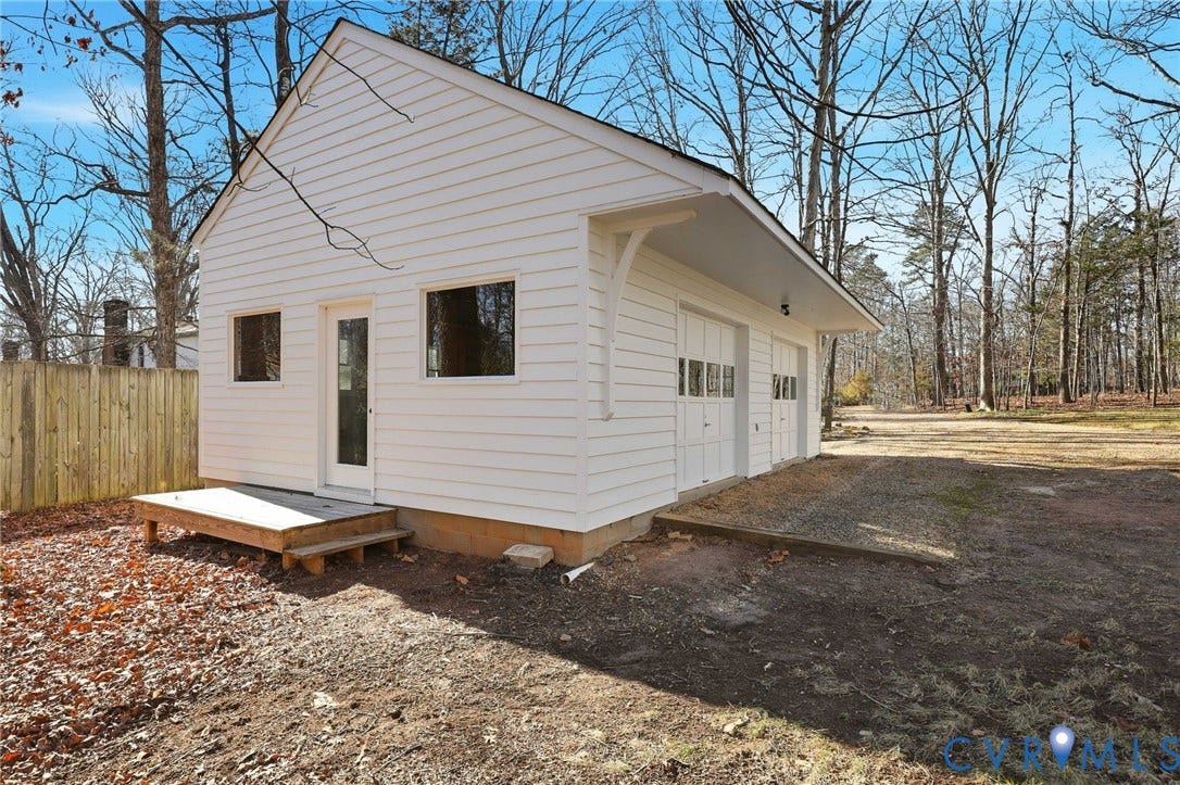 3264 Sherwood Ridge Way, Powhatan, VA 23139 Expansive wooded grounds featuring mature hardwood and evergreen trees with gently sloping terrain and open lawn space, offering privacy and natural woodland setting