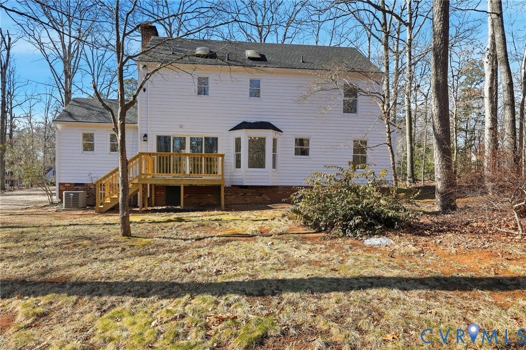 3264 Sherwood Ridge Way, Powhatan, VA 23139 Two-story Colonial exterior with a covered front porch, a red front door, and a detached garage structure
