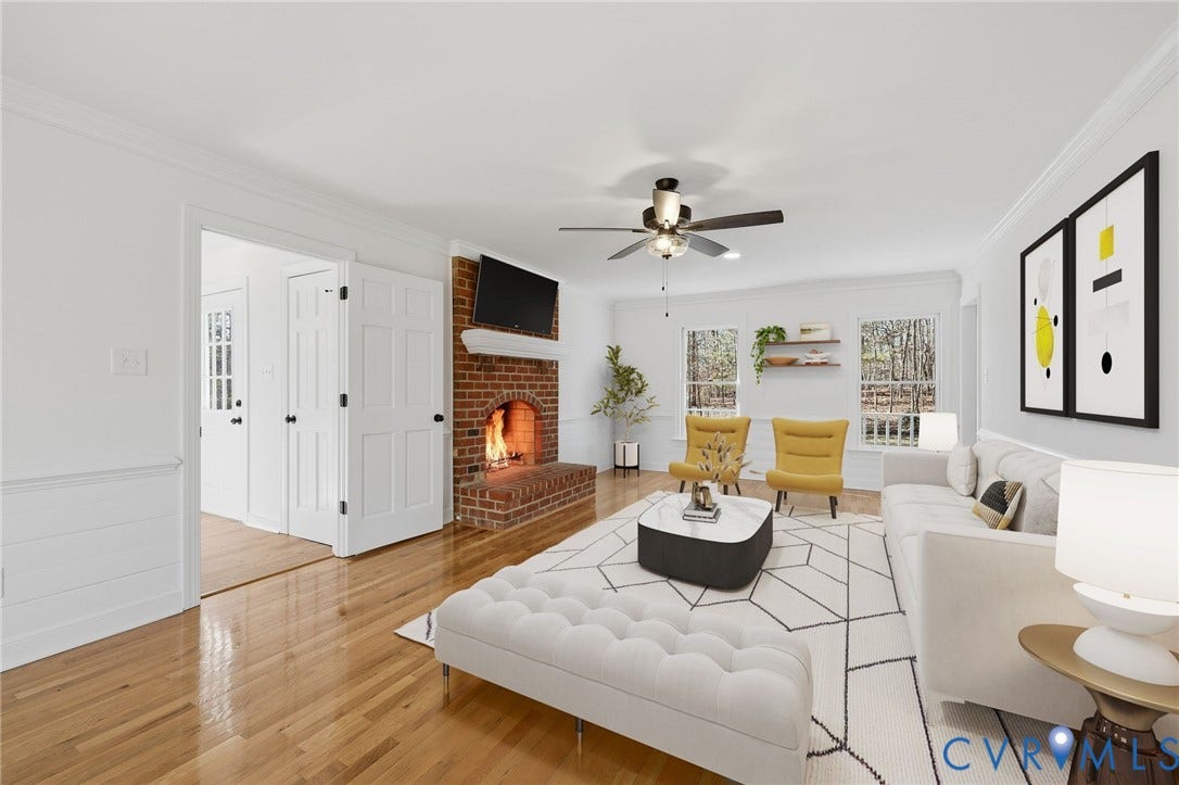 3264 Sherwood Ridge Way, Powhatan, VA 23139 Bright living room featuring hardwood flooring, a wood-burning fireplace with exposed brick surround, and ceiling fan