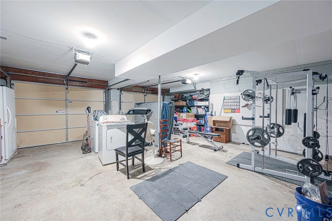 Concrete flooring garage with dual overhead doors