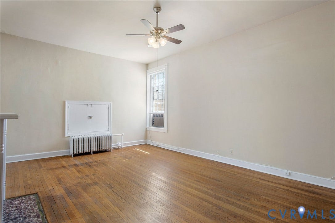 2604 Grove, #5, Richmond, VA 23220 Hardwood flooring, white trim, ceiling fan, window, and wall-mounted radiator