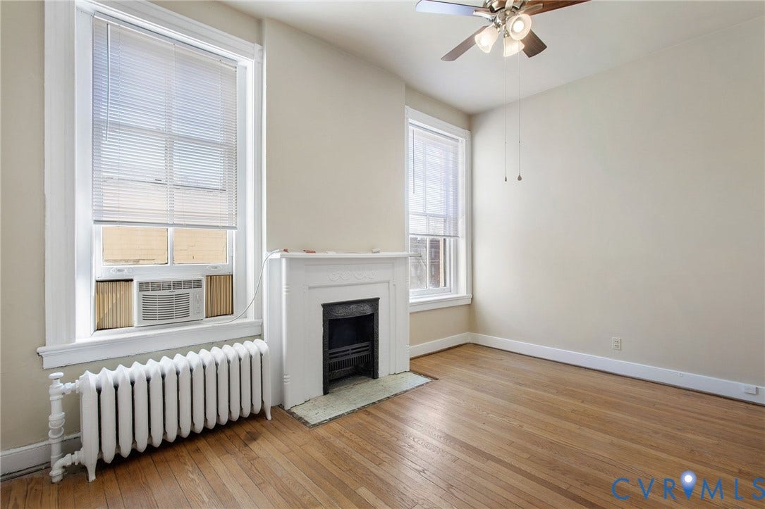 2604 Grove, #5, Richmond, VA 23220 Hardwood flooring, painted white fireplace, white trim, ceiling fan, and window blinds