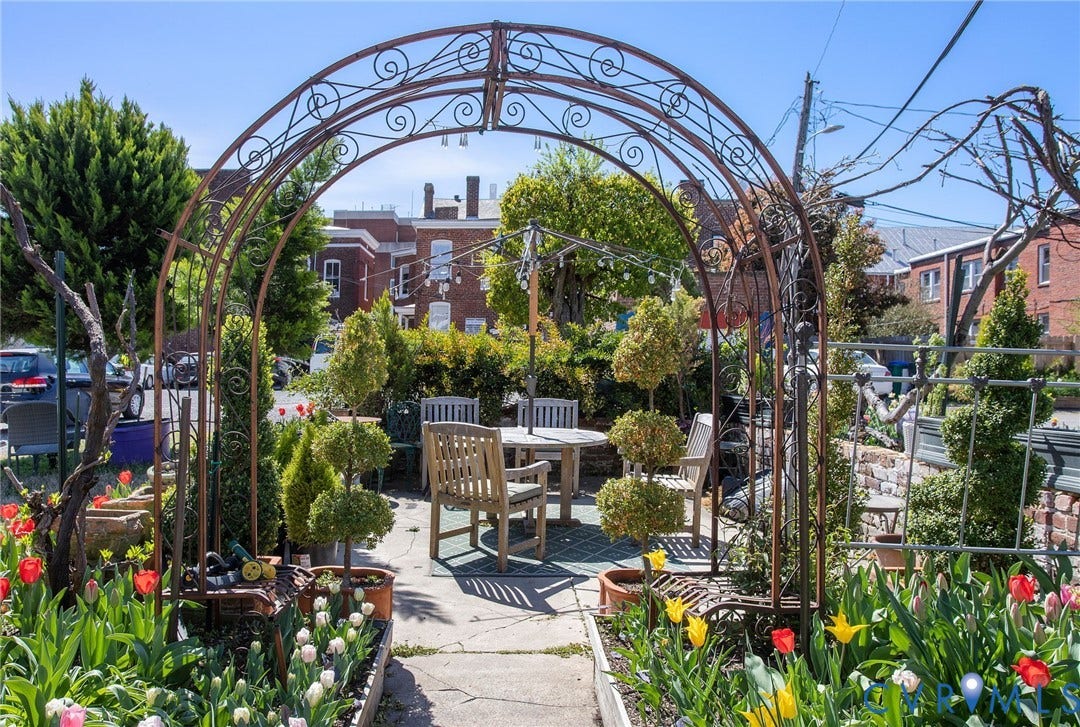 2604 Grove, #5, Richmond, VA 23220 Ornamental wrought iron archway leading to a paved patio area